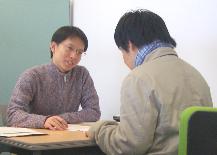 A CWP TA meets with a writing student